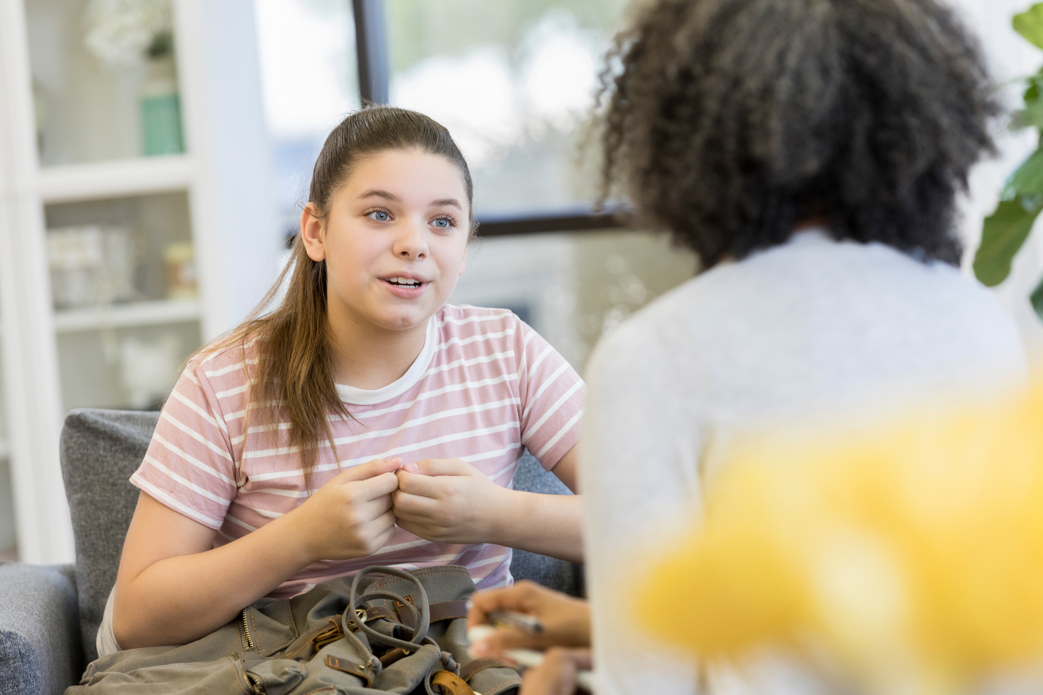 Teenager discusses an issue with guidance counselor